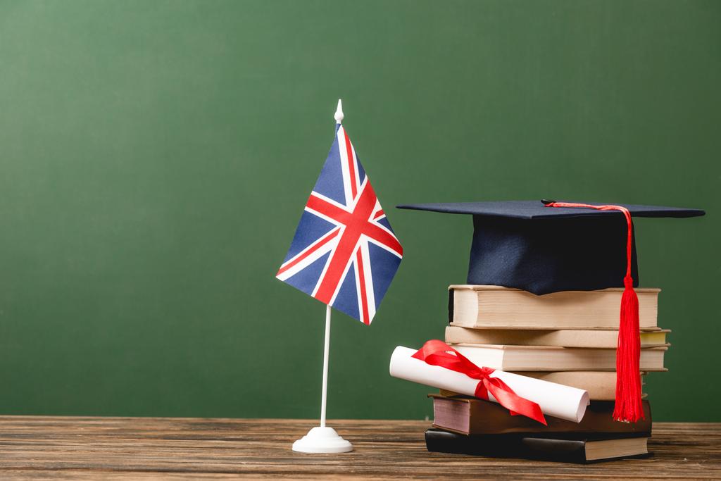 Stock Photo Books Academic Cap Diploma British Flag Wooden Surface Isolated Green 